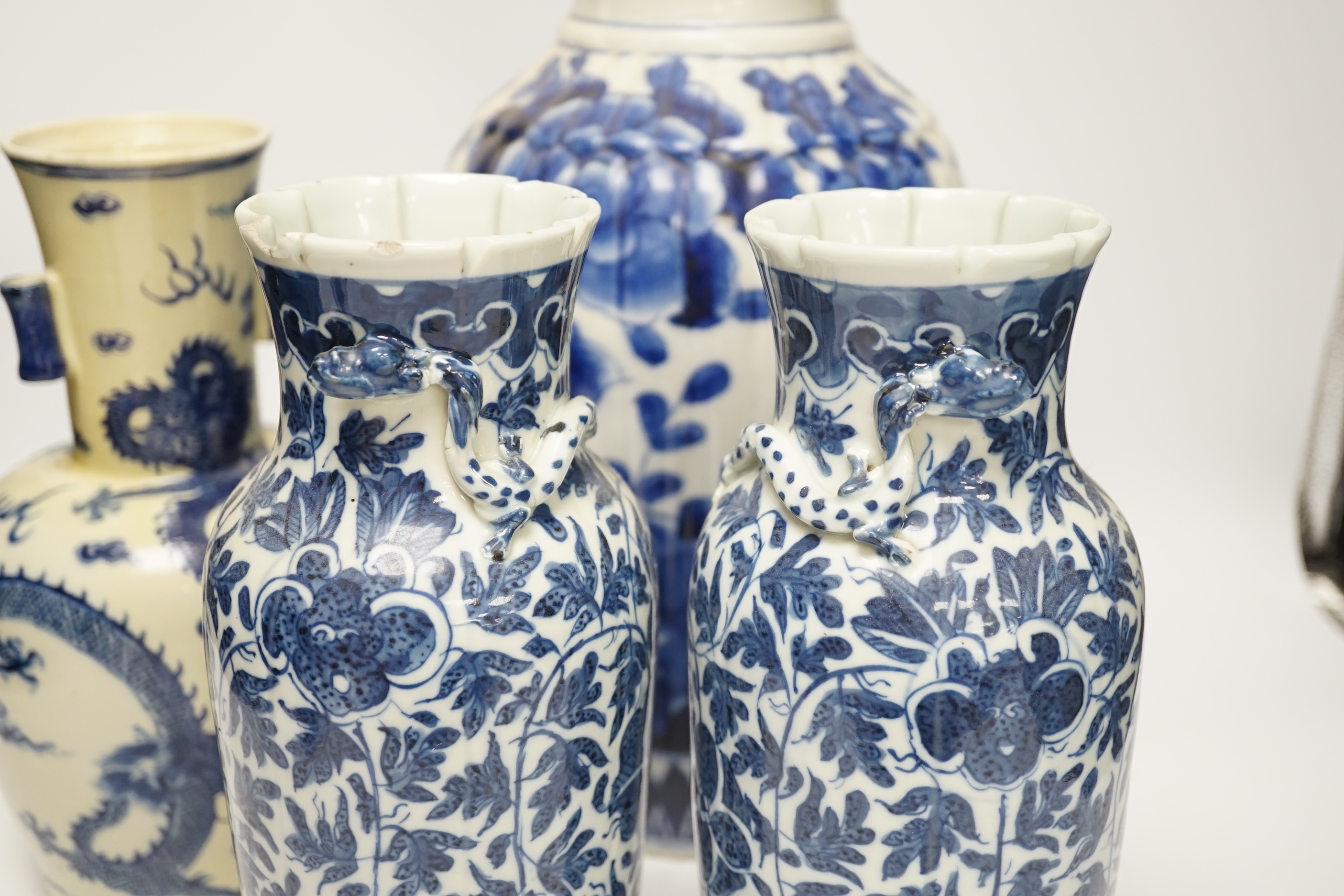 Three 19th century Chinese blue and white vases including a floral pair and a Japanese vase, largest 39cm high